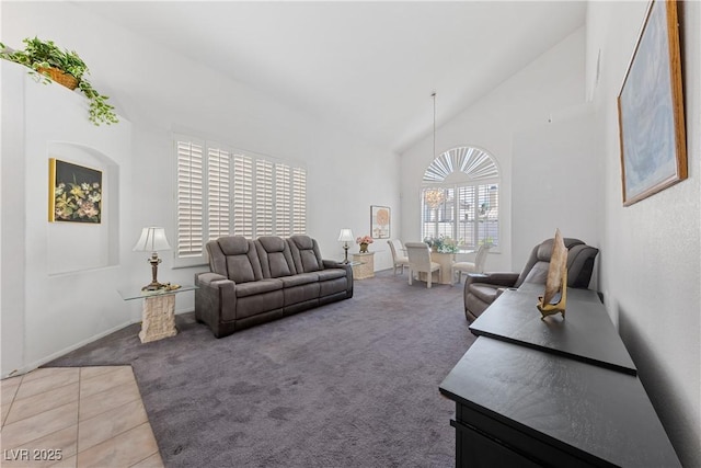 3024 Pismo Beach Dr, Las Vegas, NV 89128 - tiled living area with carpet floors, high vaulted ceiling, and baseboards