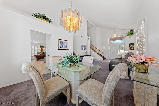 3024 Pismo Beach Dr, Las Vegas, NV 89128 - dining room featuring a chandelier, light colored carpet, healthy amount of natural light, high vaulted ceiling, and baseboards