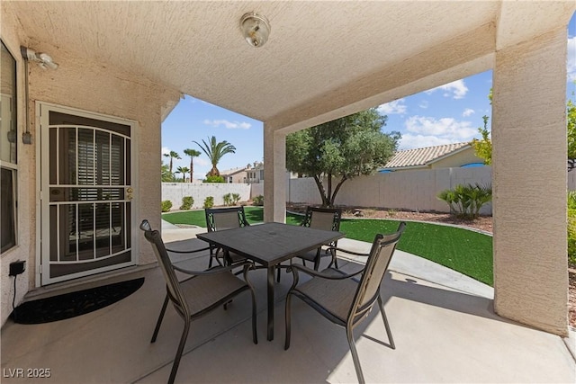 3024 Pismo Beach Dr, Las Vegas, NV 89128 - view of patio featuring outdoor dining area and a fenced backyard