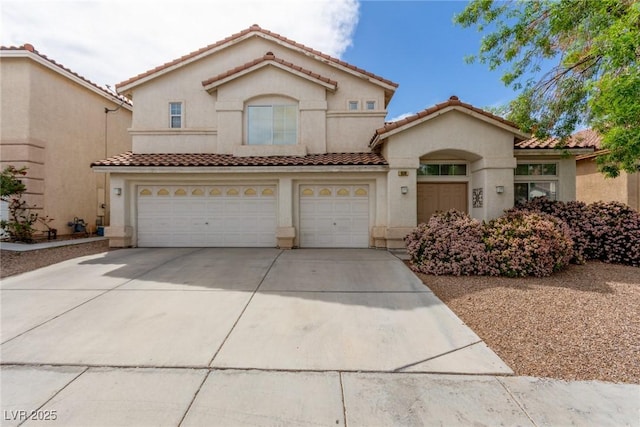9339 Bondeno St, Las Vegas, NV 89123 - mediterranean / spanish-style home featuring a tiled roof, a garage, driveway, and stucco siding
