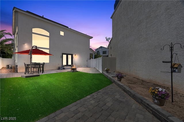 10342 Cherry Brook St, Las Vegas, NV 89183 - rear view of property with a patio area, a lawn, stucco siding, french doors, and a fenced backyard
