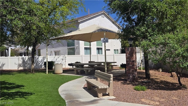 10342 Cherry Brook St, Las Vegas, NV 89183 - rear view of property with fence, a patio area, stucco siding, and a lawn