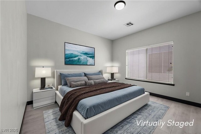 10342 Cherry Brook St, Las Vegas, NV 89183 - bedroom with light wood-type flooring, visible vents, and baseboards