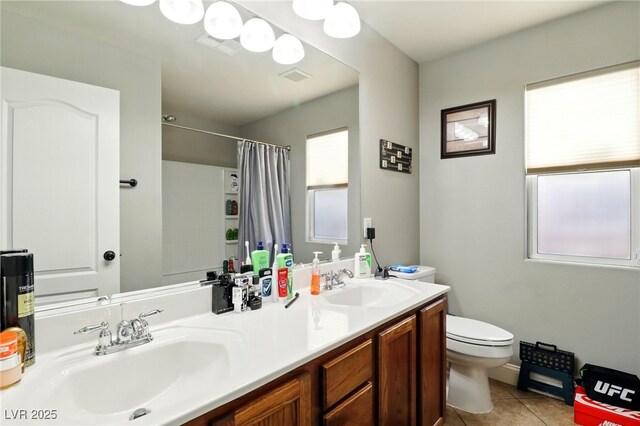 full bath with tile patterned flooring, toilet, a shower with shower curtain, and double vanity