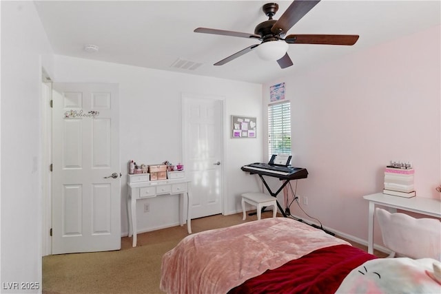 carpeted bedroom with visible vents and ceiling fan