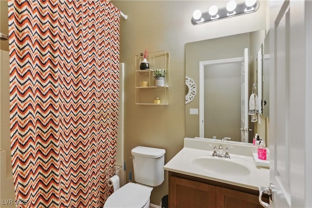 full bathroom featuring vanity and toilet