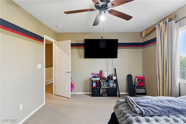 bedroom featuring baseboards, a ceiling fan, and carpet flooring