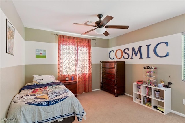 carpeted bedroom featuring a ceiling fan, baseboards, and visible vents