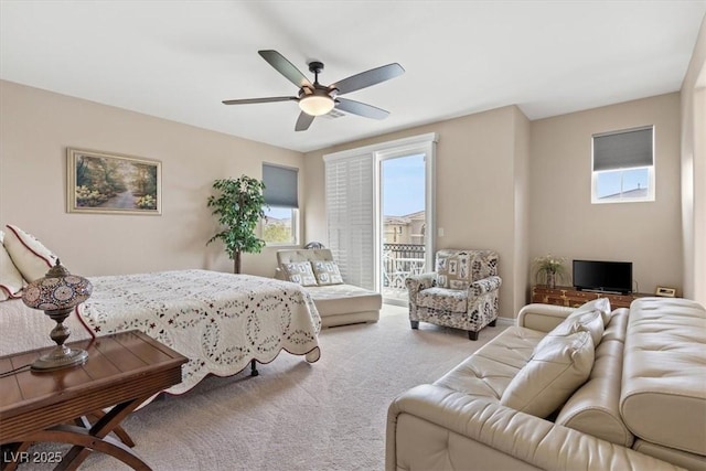 bedroom with access to outside, a ceiling fan, and carpet floors