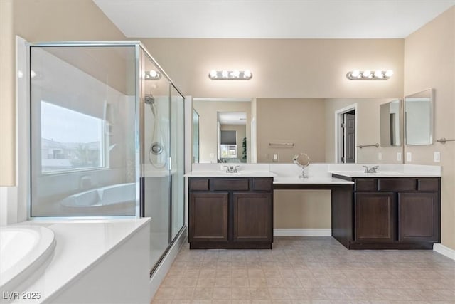 bathroom with a bath, vanity, and a stall shower