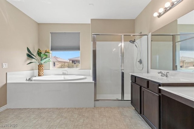 full bath featuring vanity, a garden tub, and a shower stall