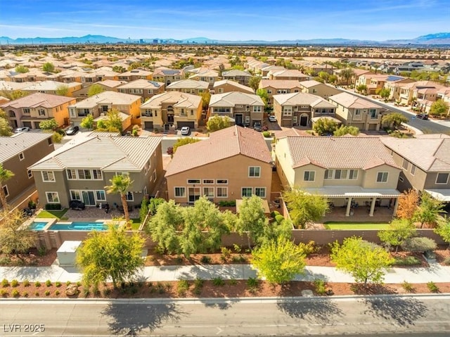 drone / aerial view featuring a mountain view and a residential view