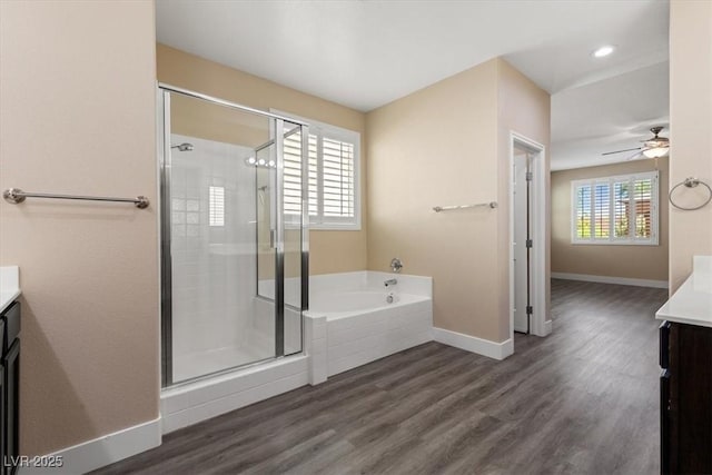 4212 Hawks Glide Ave, North Las Vegas, NV 89084 - bathroom with vanity, a garden tub, a shower stall, wood finished floors, and recessed lighting