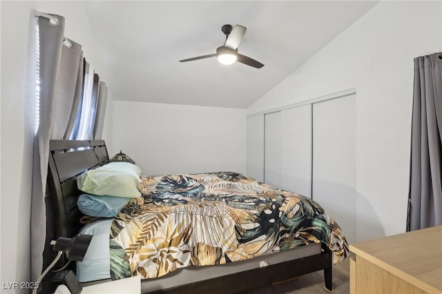 carpeted bedroom featuring a closet, ceiling fan, and vaulted ceiling