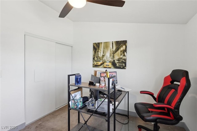 office space with a ceiling fan and carpet floors