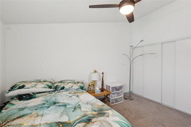 bedroom with a closet, ceiling fan, and carpet flooring