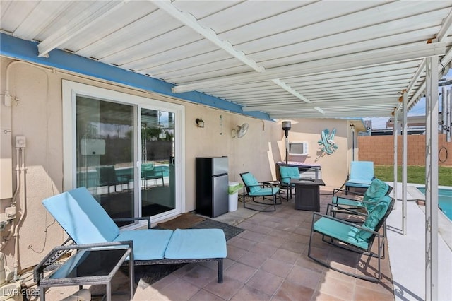 view of patio / terrace with a fenced in pool and fence