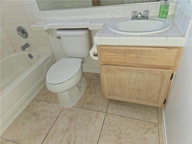 8452 Boseck Dr Unit 216, Las Vegas, NV 89145 - bathroom featuring vanity, toilet, and tile patterned flooring