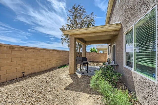 view of yard featuring a fenced backyard and a patio