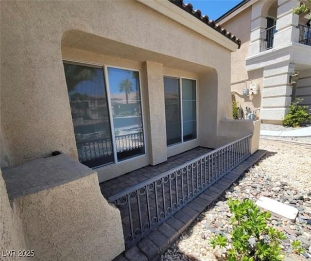 view of side of property with stucco siding