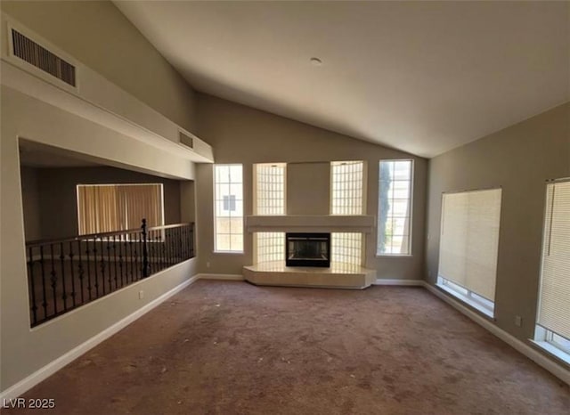 unfurnished living room featuring visible vents, baseboards, carpet, and vaulted ceiling