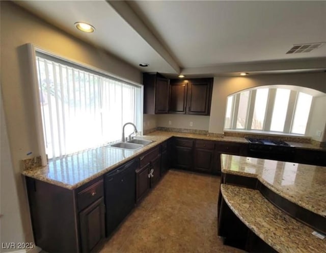 kitchen featuring visible vents, dishwasher, a sink, dark brown cabinetry, and recessed lighting