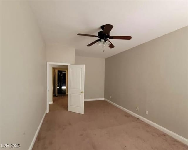 unfurnished bedroom featuring ceiling fan, light colored carpet, and baseboards