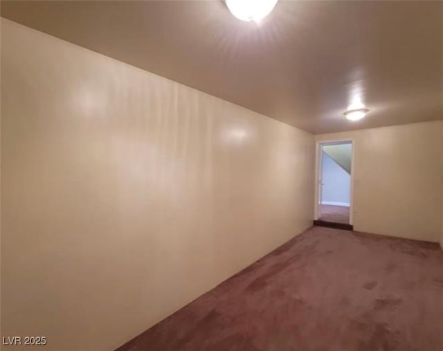 bonus room with light colored carpet
