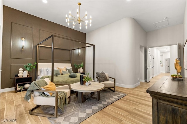 800 Jody Brook Ct, Las Vegas, NV 89145 - bedroom with light wood-type flooring, a chandelier, and baseboards