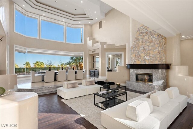 5020 Spanish Heights Dr, Las Vegas, NV 89148 - living area with hardwood / wood-style floors, a high ceiling, a fireplace, and recessed lighting
