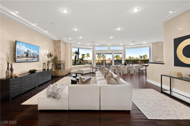 5020 Spanish Heights Dr, Las Vegas, NV 89148 - living area featuring hardwood / wood-style floors, baseboards, recessed lighting, and crown molding