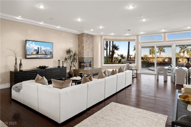 5020 Spanish Heights Dr, Las Vegas, NV 89148 - living room with a premium fireplace, dark wood finished floors, recessed lighting, and baseboards