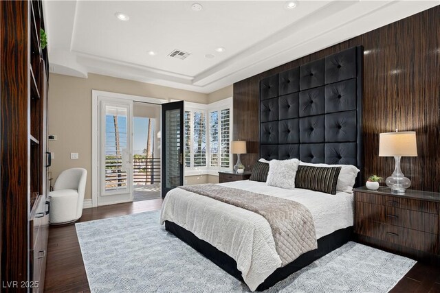 5020 Spanish Heights Dr, Las Vegas, NV 89148 - bedroom with access to exterior, dark wood-type flooring, recessed lighting, a raised ceiling, and baseboards