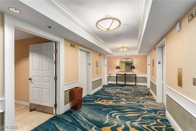 145 E Harmon Ave Unit 2019, Las Vegas, NV 89109 - hall with a tray ceiling, tile patterned flooring, ornamental molding, carpet flooring, and elevator
