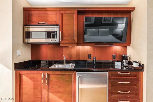 145 E Harmon Ave Unit 2019, Las Vegas, NV 89109 - bar with a sink and appliances with stainless steel finishes
