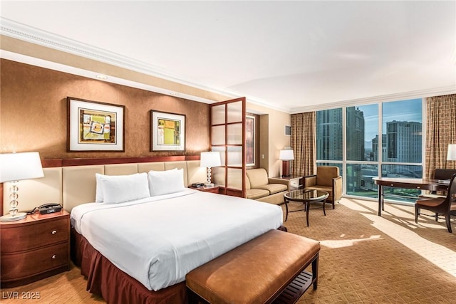 145 E Harmon Ave Unit 2019, Las Vegas, NV 89109 - bedroom with crown molding and a wall of windows
