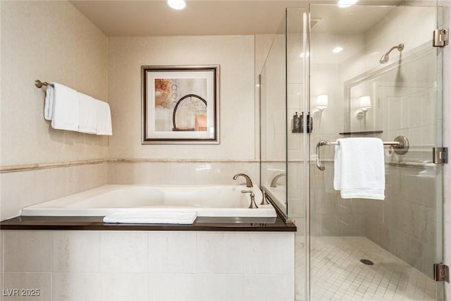 145 E Harmon Ave Unit 2019, Las Vegas, NV 89109 - bathroom featuring tile patterned floors, a stall shower, and a garden tub
