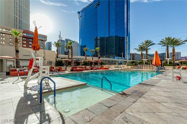145 E Harmon Ave Unit 2019, Las Vegas, NV 89109 - community pool with a patio and a city view