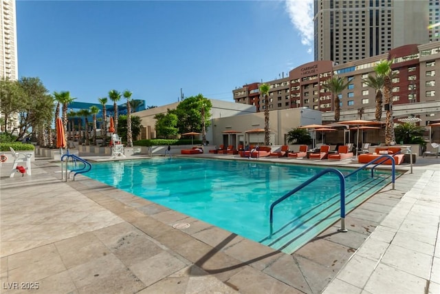 145 E Harmon Ave Unit 2019, Las Vegas, NV 89109 - pool featuring a city view and a patio area