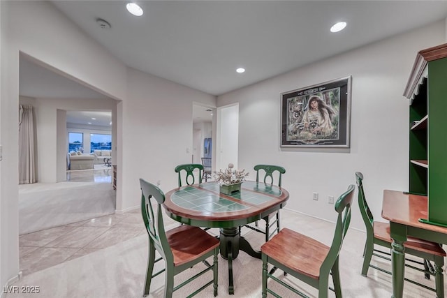 dining room with baseboards and recessed lighting