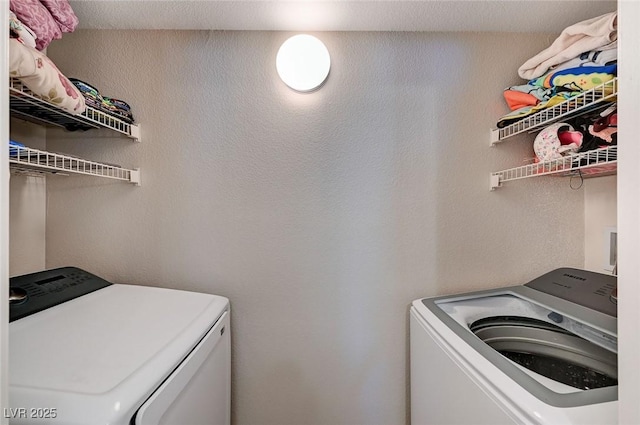 washroom featuring independent washer and dryer and laundry area