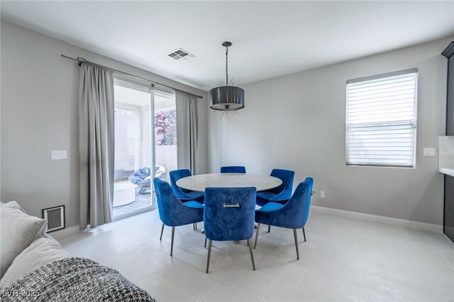 dining room featuring visible vents and baseboards