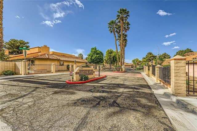 view of front of house with a chimney and fence