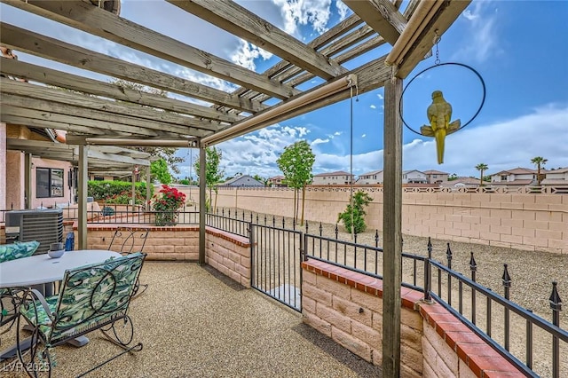 view of patio with a fenced backyard, a residential view, central AC, and a pergola
