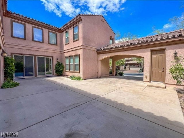2805 Proust Ct, Henderson, NV 89044 - rear view of house with a tile roof and stucco siding