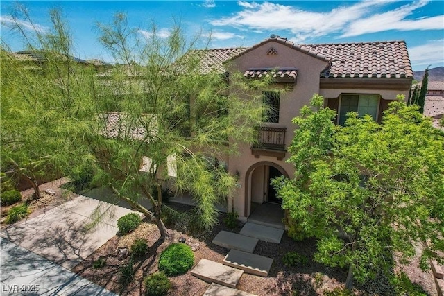 2805 Proust Ct, Henderson, NV 89044 - view of front facade featuring stucco siding, a tiled roof, and a balcony