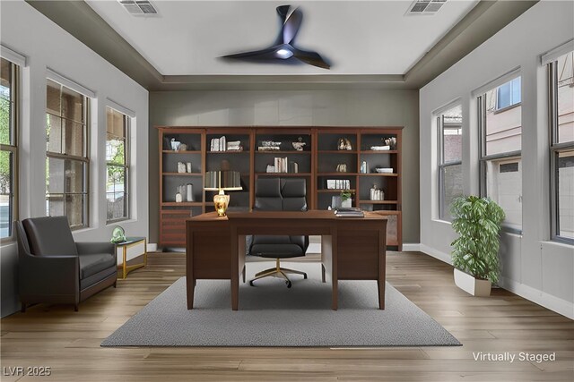 2805 Proust Ct, Henderson, NV 89044 - office area featuring healthy amount of natural light, ceiling fan, wood finished floors, and a tray ceiling