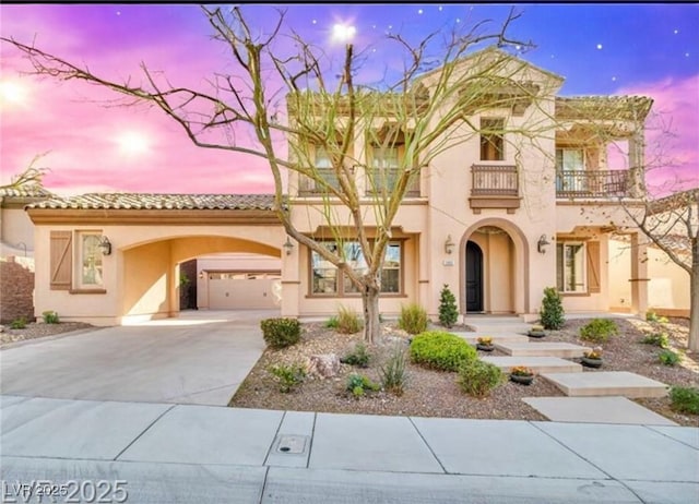 2805 Proust Ct, Henderson, NV 89044 - mediterranean / spanish-style home featuring a balcony, stucco siding, and concrete driveway