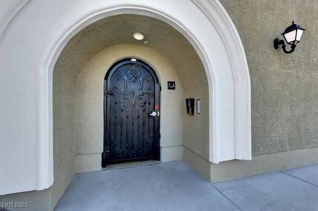 doorway to property with stucco siding