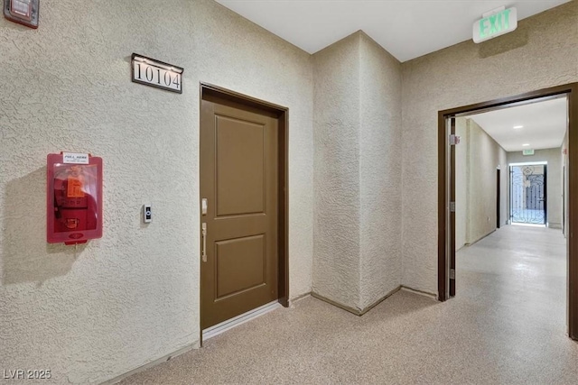 corridor with a textured wall